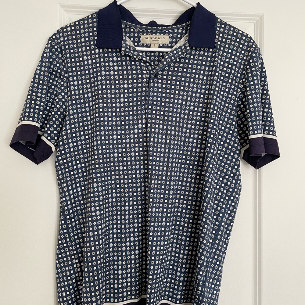 Men’s Burberry blue patterned polo.